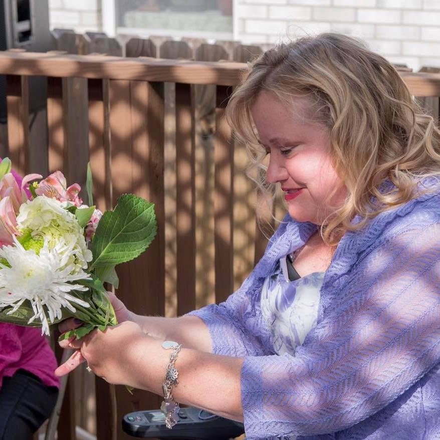 Terri making a boquet at her friend's wedding.